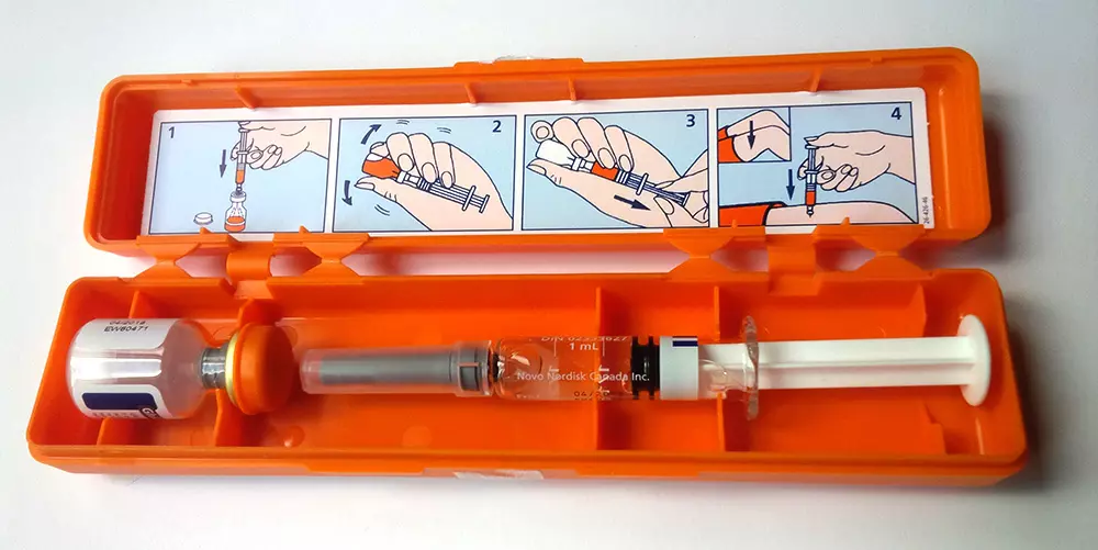 Glucagon kit, including saline-filled syringe and vial of powdered solution